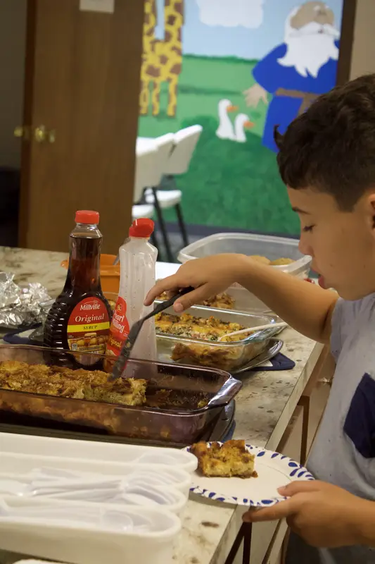 Youth serving at fellowship dinner